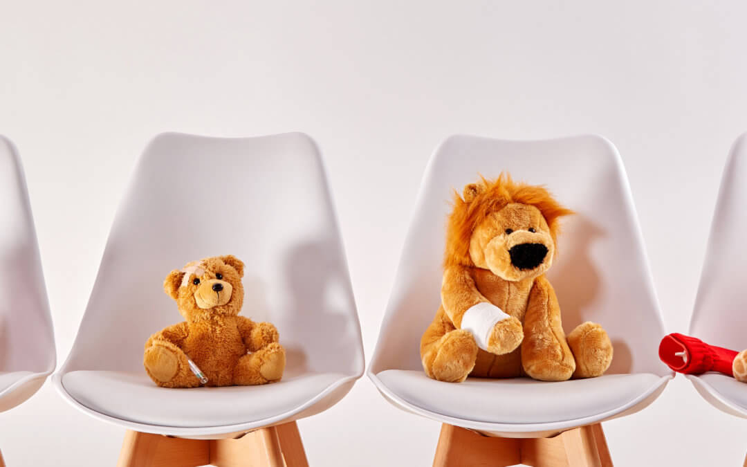 Teddies waiting in a doctors office to receive some first aid